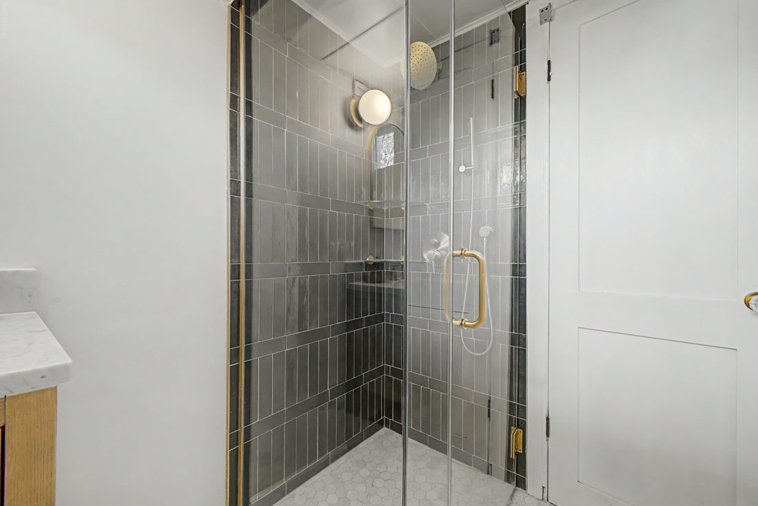 Walk-in tile shower by JAC Enterprise